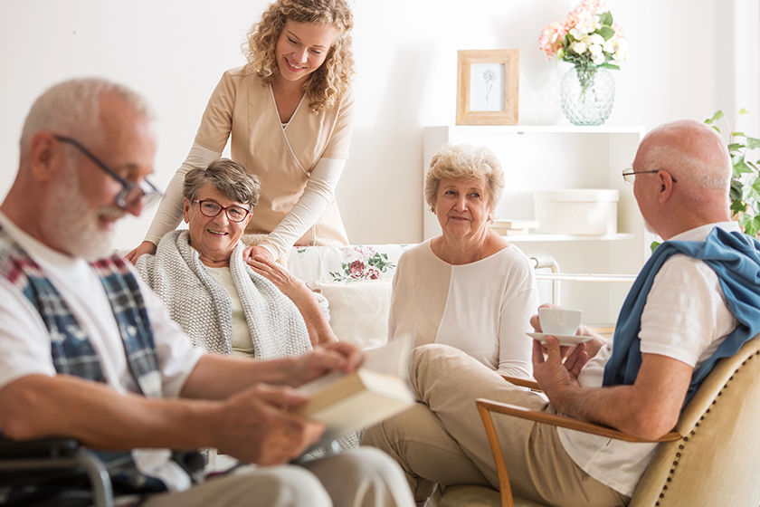 group-of-senior-friends-sitting-together-at-nursing-home